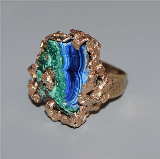 A late 1960s 9ct. and malachite set modernist dress ring, size L.